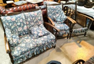 An early 20th century oak barley twist and bergère two seater settee with matching armchairs,