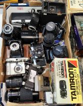A collection of vintage SLR and other cameras, lenses and other accessories etc