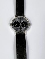 A customised dual time watch with twin winders and black and white striped dial