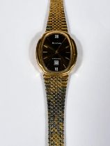 BULOVA: a vintage gold plated automatic watch with brown dial, gold hands, seconds sweep and baton