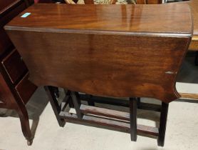 An early 20th century mahogany small Sutherland table; an oak barley twist occasional table with