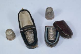 Two silver thimbles, cased; 2 thimbles