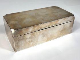 A canted rectangular engine turned hallmarked silver cigarette box, Birmingham 1930