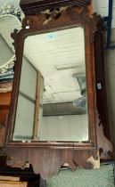 A Chippendale style wall mirror in parcel gilt & fretwork frame.