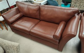 A traditional Knoll style 3 seater settee in brown hide.