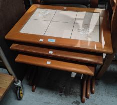 A nest of three 1970's tile top occasional tables.