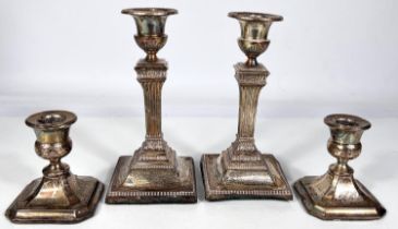 A pair of square reed column hallmarked silver candlesticks on weighted bases, Sheffield 1926 ht. 17