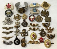 A selection of various military badges and buttons; etc.