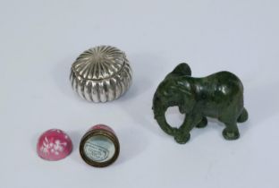 A white metal box; an enamelled box; a jade coloured hardstone elephant