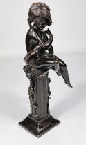 A bronze figure of a girl sitting on column with vines, ht. 28cm