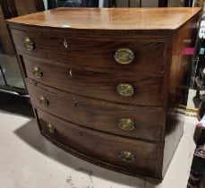 A Georgian mahogany bow front chest of 4 graduating long drawers with oval brass drop handles (no