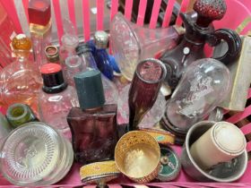 A collection of perfume and similar glass bottles