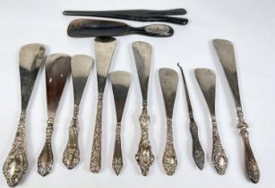 Eight various hall marked silver button hooks and shoe horns, and an ebony and silver mounted pair