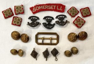 A collection of Somerset WWII period infantry badges; etc.