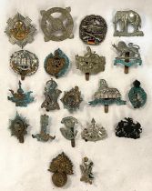 A collection of various military cap badges; etc.