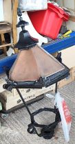 A large Victorian style street lantern top of cast metal and copper, glass missing