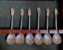 A set of 6 hallmarked silver commemorative anointing spoons with figural terminals, London,