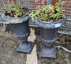 A pair of stoneware garden urns