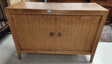 A mid 20th century Gordon Russell Double Helix light wood sideboard double doors with incised