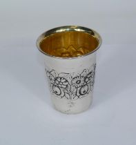 A white metal embossed beaker, stamped '925' to base, 35gm