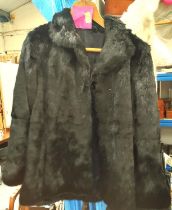 A short black Coney Fur Jacket.