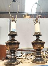 A pair of heavy brass table lamps in the classical style