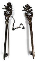 A pair of white metal kilt pins with Lion Rampant terminals