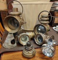 A selection of 19th century brass lamps of various kinds and sizes, coach mans, hanging etc