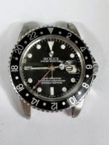 ROLEX GMT-MASTER: A Rolex Perpetual Date GMT-Master black dial and bezel gentleman's wristwatch with