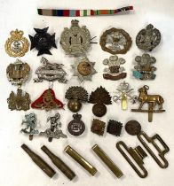 A selection of various military badges and buttons; etc.