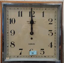 A 1930's wall clock in square oak case, by Garrard