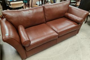 A traditional Knoll style 3 seater settee in brown hide.