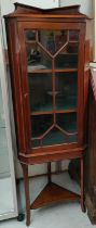 An Edwardian inlaid mahogany display cabinet with single door and undertier