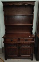 An reproduction oak Old Charm Welsh dresser with two height shelves and cupboards and drawers below