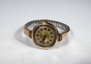 An early 20th century ladies yellow metal wristwatch, the back plate stamped 375 with expanding