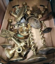 A good selection of brass candlesticks and other brassware