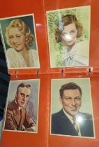 An album of Classic cigarette cards, film star actors in their studios, monochrome, on paper; a