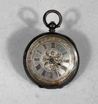 An Edwardian chased silver fob watch with gilt decoration