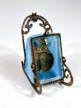 A 19th century watch stand in gilt metal and opaque blue glass