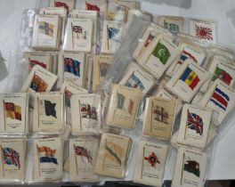 A very large collection of Kensington cigarette silks:  flags; countries; British empire