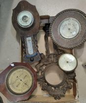 Four various wall hanging barometers