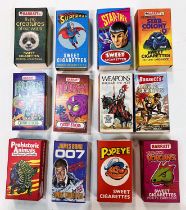 A collection of sweet cigarette packs by Barratt and others:  Thunderbirds; Star Trek; Superman;