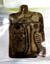 A small ceramic rectangular amulet with Egyptian hieroglyph markings, 2.5cm