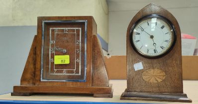 A Sheraton style inlaid mahogany lancet top mantel clock; an Art Deco walnut mantel clock