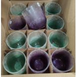 A set of glass coloured vases/candleholders