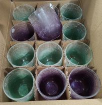 A set of glass coloured vases/candleholders