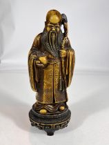 A bone coloured resin figure of Chinese sage