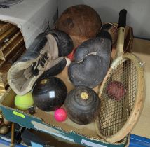 A selection of vintage sporting items:  boxing gloves; medicine ball; bowls; etc.
