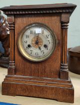 An Edwardian architectural oak cased striking mantle  clock