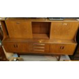 A mid 20th century G-plan teak 'Fresco' sideboard with high back, three central drawers, two